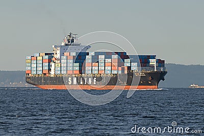 SM Line container ship Qingdao approaches Seattle in evening light Editorial Stock Photo