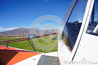 Small aircraft on rural airstrip, ready for take-off. Editorial Stock Photo