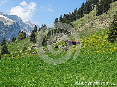 Small alpine hut in swiss Alps near Oeschinensee in Kandersteg Stock Photo