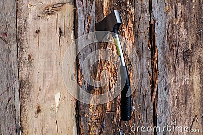 Axe on a wooden board Stock Photo