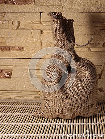 A small bag on a beige background. A canvas bag on a wooden Mat Stock Photo