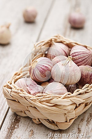 Small basket with garlic Stock Photo
