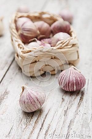 Small basket with garlic Stock Photo