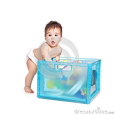 Small beautiful baby boy with a blue box Stock Photo