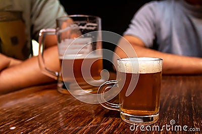 Small beer chopp. Big chopp and people on the background. Schop, Schopp, Schoppen Stock Photo