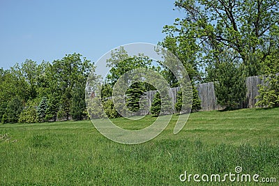 Small berm with evergreen trees Stock Photo