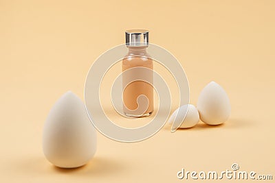 Small, medium and large white beauty blender and makeup foundation Stock Photo