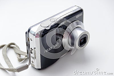 Small black camera on a gray background Editorial Stock Photo