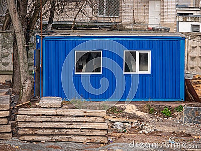 Small blue change house for workers at construcrion area Stock Photo