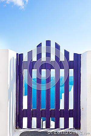 Small blue fence gate in Oia on Santorini island, Greece Stock Photo