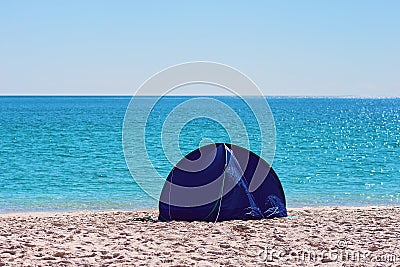 A Small Blue Shade Tent On A White Silica Sand Beach In Whitsundays Australia Stock Photo