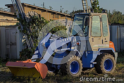 A small blue wheel loader Editorial Stock Photo