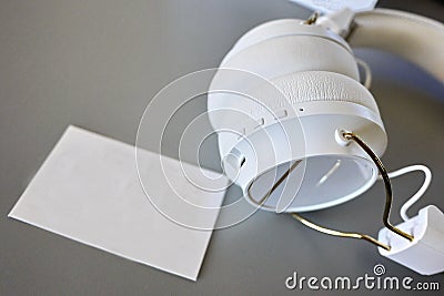 Small Bluetooth headphones, white color, close-up Stock Photo