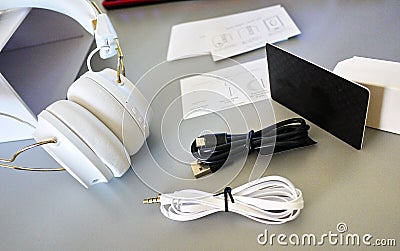 Small Bluetooth headphones, white color, close-up Stock Photo