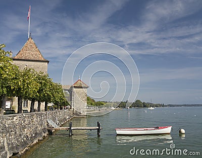 Small boat on the Geneva lake near the Chateau de Rolle Stock Photo