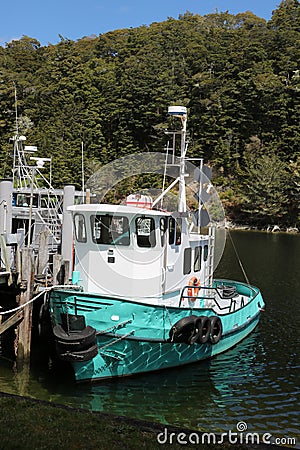 Small boat, Pearl Harbour, Manapouri, New Zealand Editorial Stock Photo