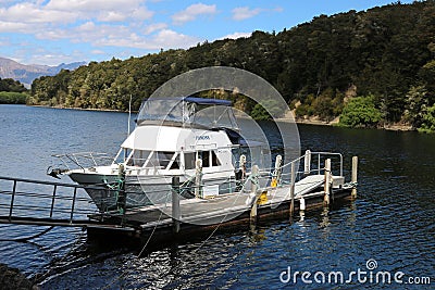 Small boat, Pearl Harbour, Waiau River, Manapouri Editorial Stock Photo