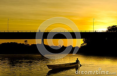 Small boat at sunset Stock Photo