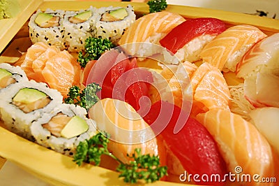 Small boat with sushi v2 Stock Photo