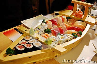 Small boat with sushi v3 Stock Photo