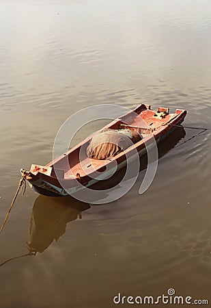 A small boat waiting for a fisherman. Stock Photo