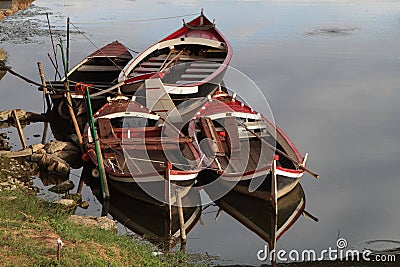 Small boats on Arno River in Florence Stock Photo