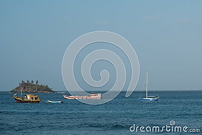 Small boats and island ocean horizon Editorial Stock Photo