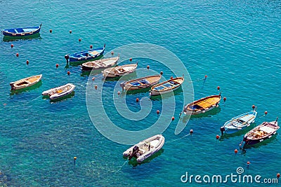 Small boats moored in calm lagoon Stock Photo