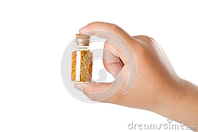 Small bottle with pollen in child hand Stock Photo