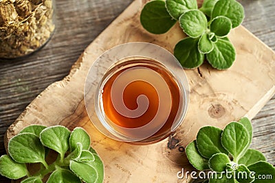 A small bowl of Coleus amboinicus syrup for common cold Stock Photo