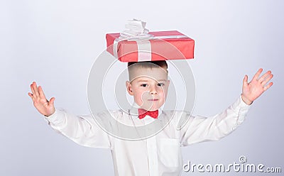 Small boy hold gift box. Christmas or birthday gift. Dreams come true. Buy gifts. Happiness and positive emotions Stock Photo