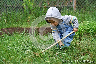 Small boy with rake Stock Photo