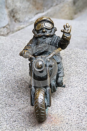 The small bronze statue gnome by name - Wentyl, gnome-biker on motorcycle Editorial Stock Photo