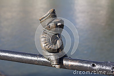 Small bronze statue of Good Soldier Svejk attached to the handrails at Kyivska embankment of the river Uzh in Uzhgorod Ukraine pho Stock Photo