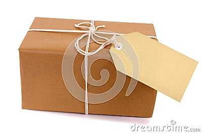 Small brown parcel package, manila label Stock Photo