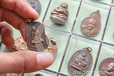 Small Buddha image or Thai Amulets & Talismans Stock Photo