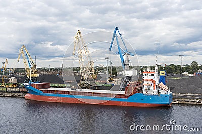 Small bulk carrier ship loading coal Riga Editorial Stock Photo