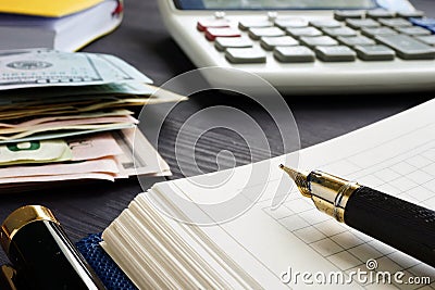 Small business bookkeeping and investment. Calculator and money. Stock Photo