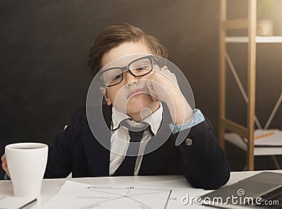 Small business boy got bored in office Stock Photo