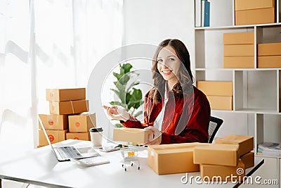 Small business entrepreneur SME freelance woman working at office, BOX,tablet and laptop online, marketing, packaging, delivery, Stock Photo