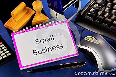 Small business-entrepreneurship of small firms. On the Desk of the owner of the computer mouse, keyboard, calculator, Notepad, Stock Photo