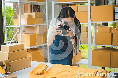 Small business owners online are taking pictures of their products and offering them to customers who will place their orders. - Stock Photo