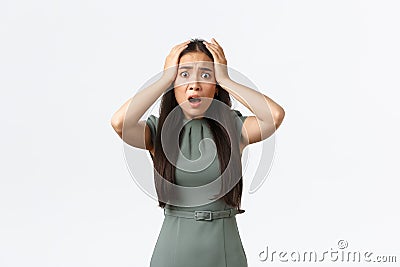 Small business owners, women entrepreneurs concept. Shocked asian woman in panic, grab head and looking startled with Stock Photo