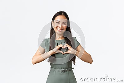 Small business owners, women entrepreneurs concept. Caring and pleasant asian woman, businesswoman care for clients Stock Photo