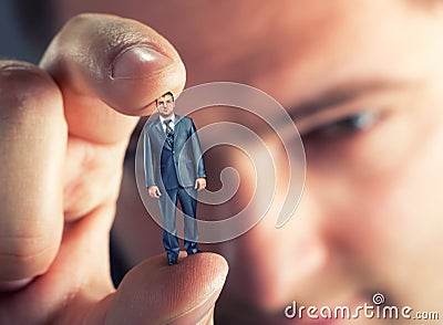 Small businessman in hand Stock Photo