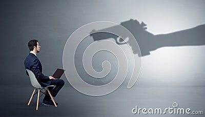 Businessman staying and offering stuffs for an armed shadow hand Stock Photo