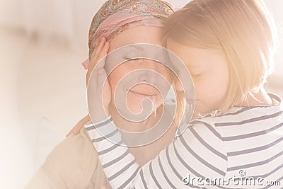 Small caring child embracing mother Stock Photo