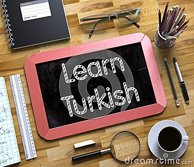 Small Chalkboard with Learn Turkish. 3D Illustration. Stock Photo