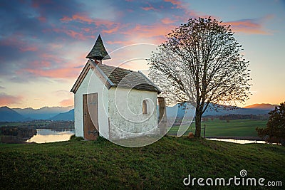 Small chapel on the hill, dreamy sunset scenery upper bavaria Stock Photo