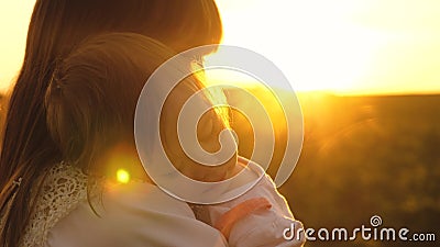 Small child fell asleep in arms of his mother, walk mom and daughter at sunset in park in the summer, slow-motion. Small child fell asleep in arms of his mother stock video Small child fell asleep in arms of his mother, walk mom and daughter at sunset in park in the summer, slow-motion. Small child fell asleep in arms of his mother stock video